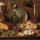 Carlo Magini (Fano 1720-1806), Natura morta con verdura, pane, testa di vitello e oggetti da cucina, 1760-1800 circa, olio su tela.