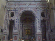 immagine di Crocifisso adorato da san Francesco e da altri santi francescani e Madonna col Bambino e sante francescane