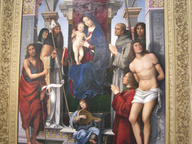 immagine di Pala Feliciti - Madonna col Bambino in trono e i Santi Giovanni Battista, Monica, Agostino, Francesco d’Assisi, Proco, Sebastiano, il donatore Felicini e un angelo musicante