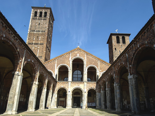 Facade and colonnade of the Romanesque Cathedral of Saint Ambrogio, Milan | Photo: Paolo Bona / Shutterstock.com