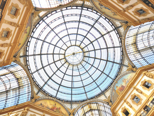Architectural details of Galleria Vittorio Emanuele II in Milan, The Gallery is a shopping arcade designed by Giuseppe Mengoni | Photo: Arseniy Krasnevsky / Shutterstock.com