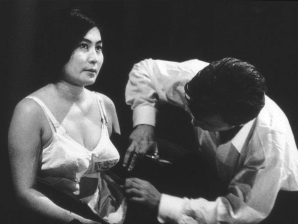 Yoko Ono, Cut Piece, 1964, Performed by Yoko Ono, Carnegie Recital Hall, New York, March 21, 1965 | © Minoru Niizuma, Courtesy Lenono Photo Archive, New York Courtesy Merano Arte “Gestures - Women in action”