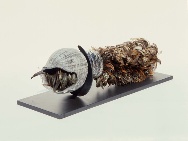 Liliane Lijn, Soften the Mouth, Zinc blown glass, feather dusters, anodised aluminium, black Italian honed slate base, 1987 – 1990