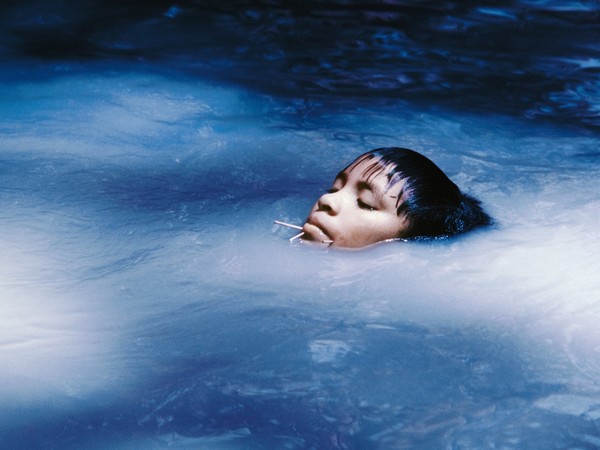 Claudia Andujar, The young Susi Korihana thëri swimming, infrared film, Catrimani, Roraima, 1972–74