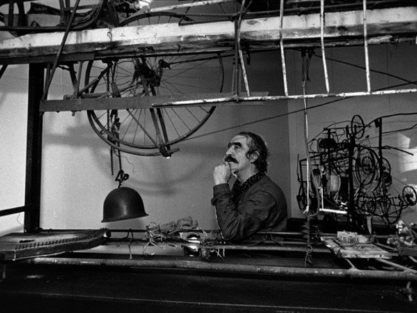 Renè Burri, Swiss Sculptor Jean TIinguely with his sculpture "Si c'est noir, je m'appelle Jean" (1960) for his retrospective at the Kunsthaus Zurich, 1982