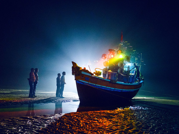 Arko Datto, <em>Boats bedecked with lights returning from a pilgrimage wait in the shoals for the tide to return so that they can head back home to their village</em>, 2019