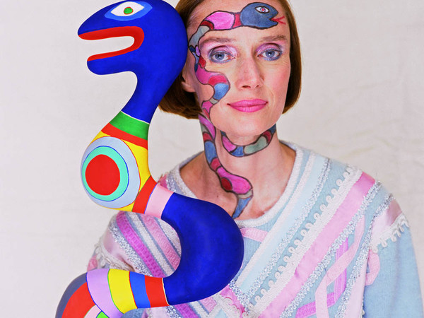 Niki De Saint Phalle with her sculpture, 1983