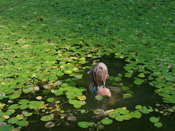 Lucas Foglia, Maddie with Invasive Water Lilies