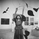 Dino Jarach (1914 - 2000), Peggy Guggenheim con Arco di petali di Alexander Calder alla Biennale di Venezia, Venezia, 1948, Stampa a posteriori, Stampa alla gelatina d’argento, Peggy Guggenheim Collection Archives, Venice | Courtesy of Solomon R. Guggenheim Foundation Photo Archivio Camera Photo Epoche Gift, Cassa di Risparmio di Venezia, 2005