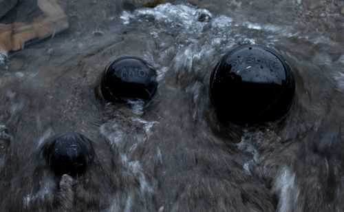 Gaia De Megni, Il mito dell’androgino, 2020, engraved Marquinia black marble spheres, 8x15x20 cm.