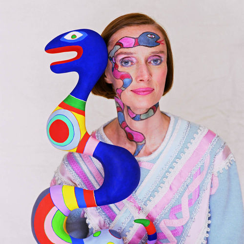Niki De Saint Phalle with her sculpture, 1983