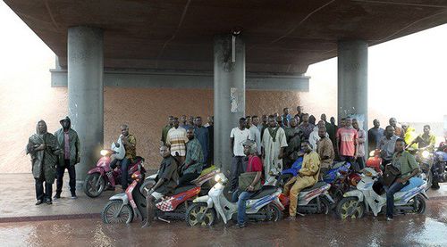 <span>David Claerbout, Oil workers (from the Shell company of Nigeria) returning home from work, caught in torrential rain, 2013</span>